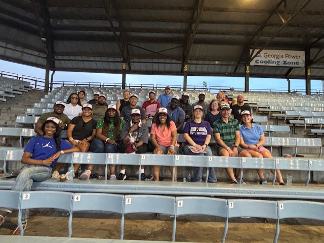 Fifth doctoral IT cohort attends a Macon Bacon baseball game.