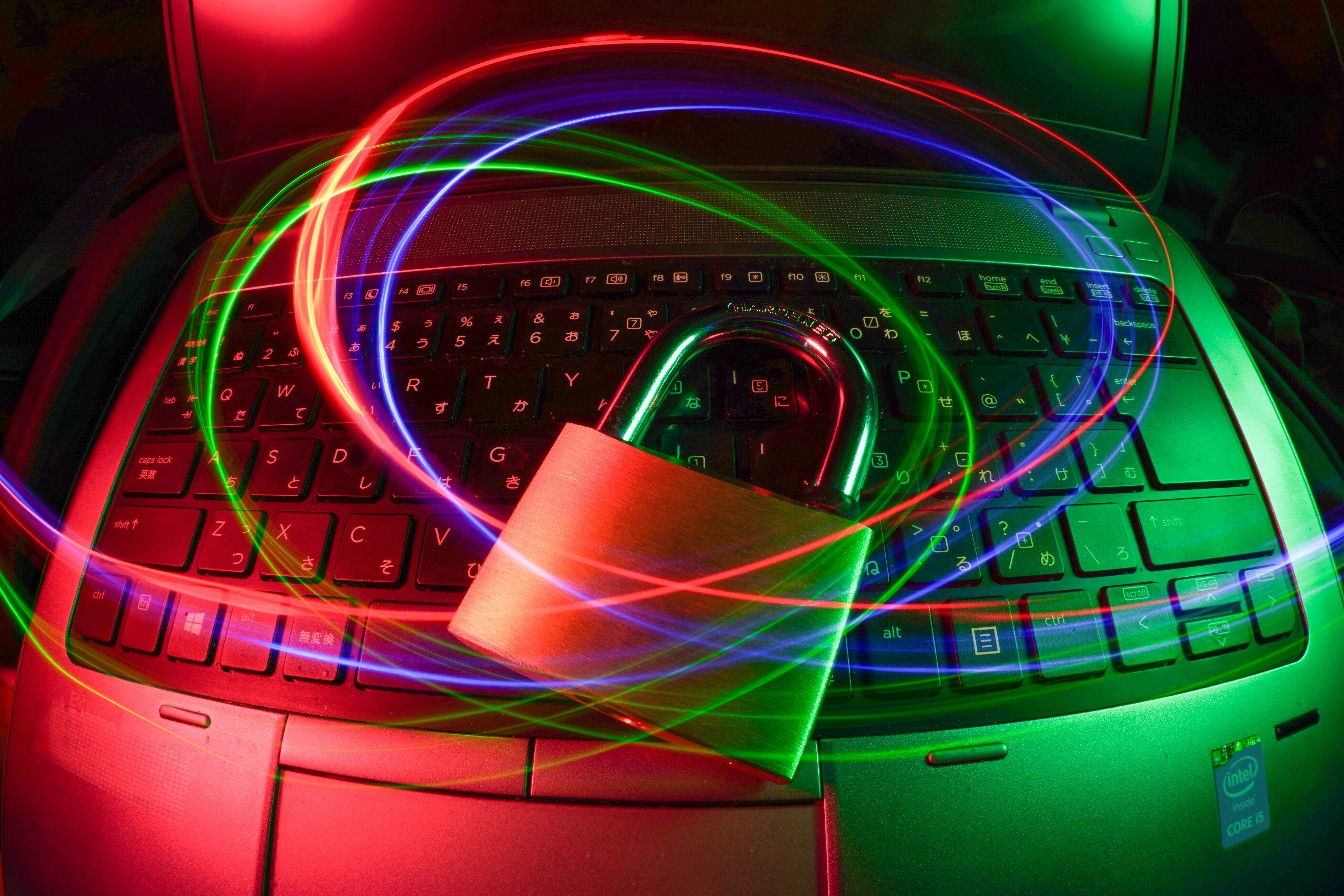 Lock rests on a keyboard with neon lights. 