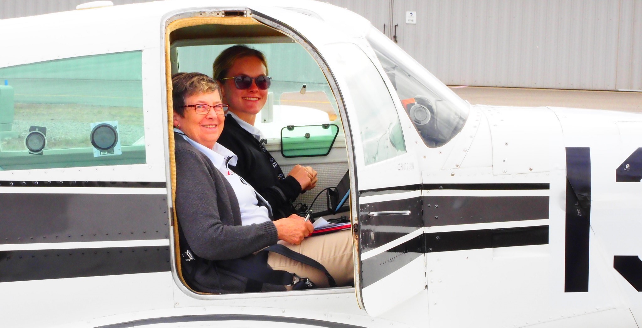 Annabelle Kellogg in a plane alongside her co-pilot Gretchen Jahn.