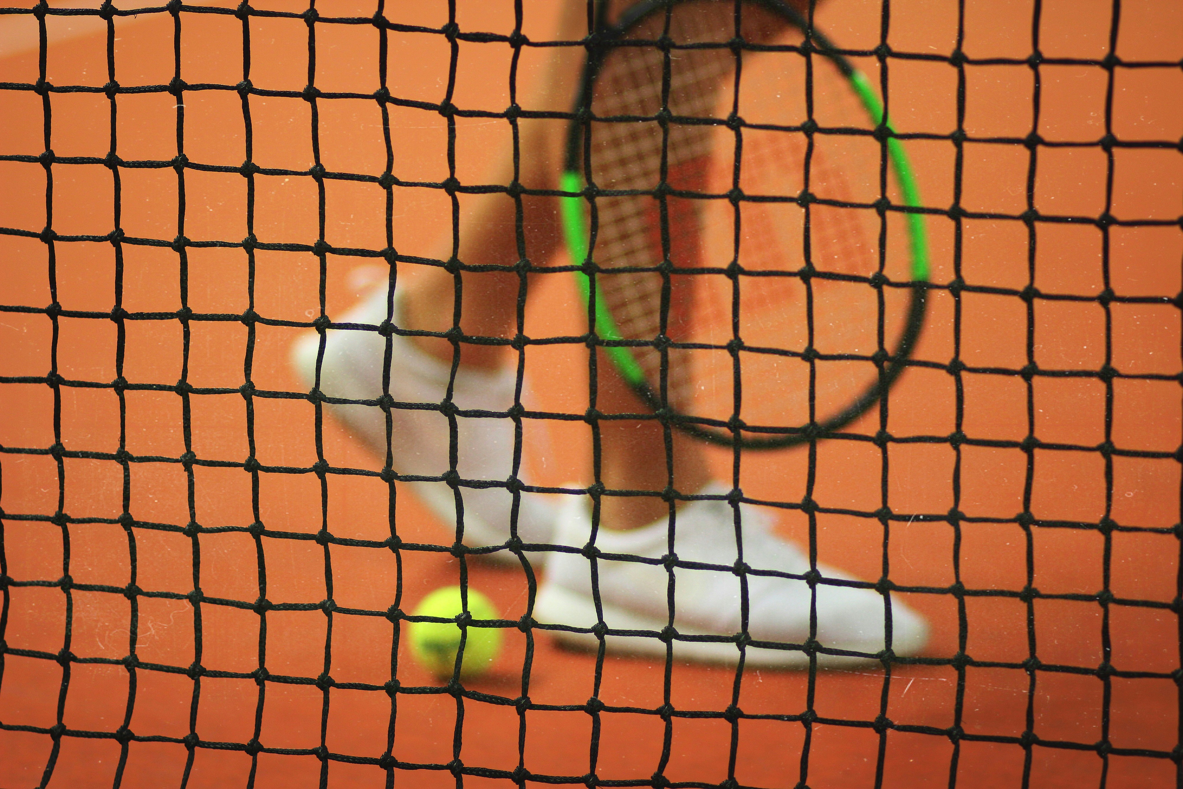 Close up photo of a tennis net. 