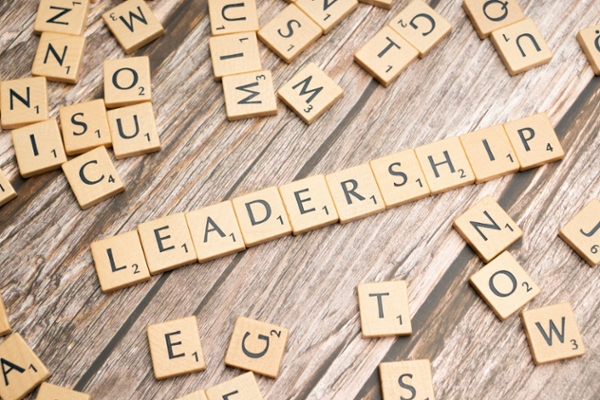Scrabble letters spell out the word, "leadership."