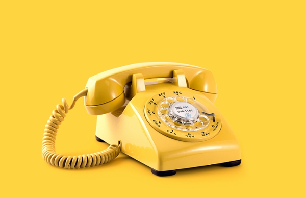 Yellow rotary phone. 