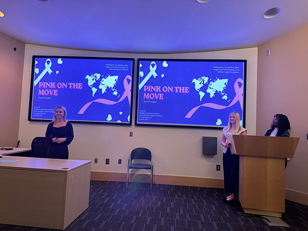 Trio of students presenting their proposals.