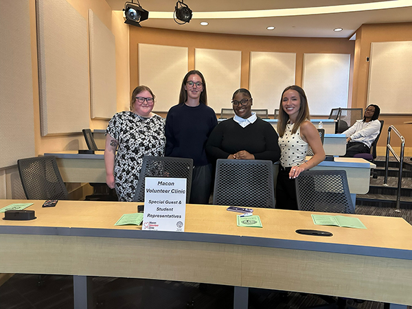 Group of students from the grant writing course posing before their presentation.