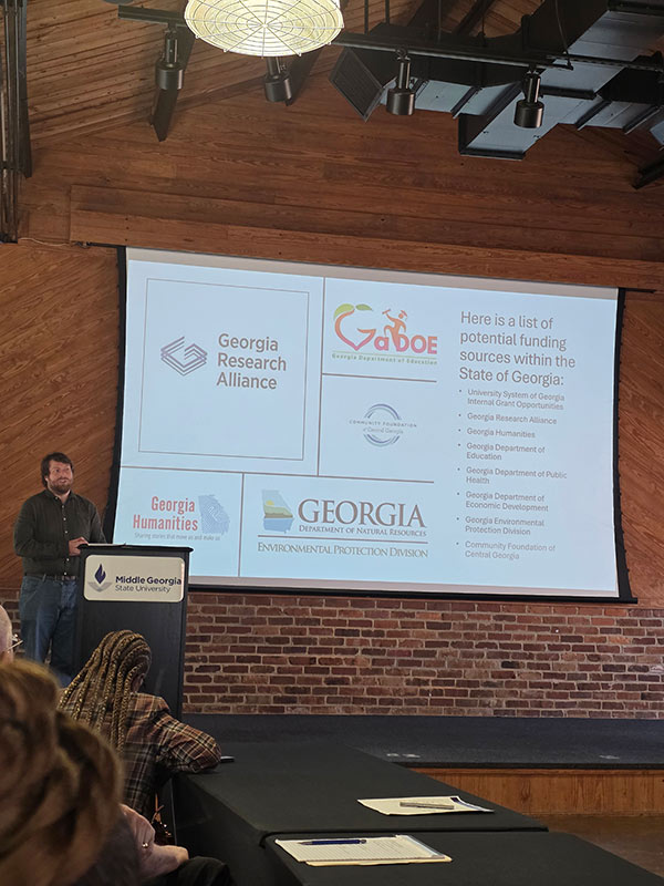 MGA staff member giving presentation at the CMGS/ORSP event.