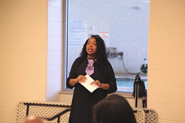 Staff council member speaking at the ceremony.