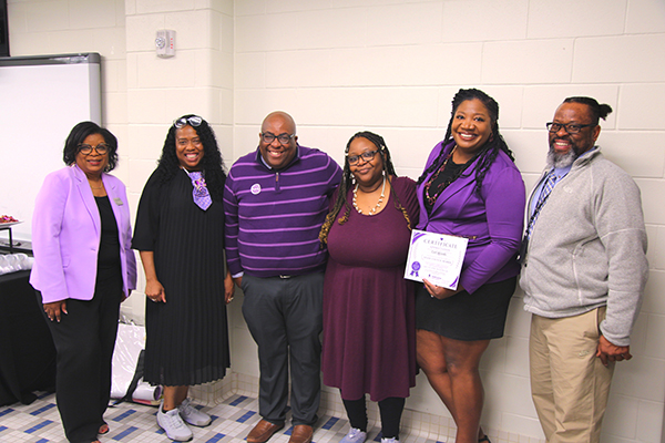 Group of award recipients posing for a photo at the ceremony.