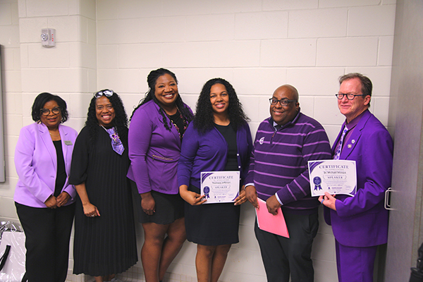 Group of award recipients posing for a photo at the ceremony.
